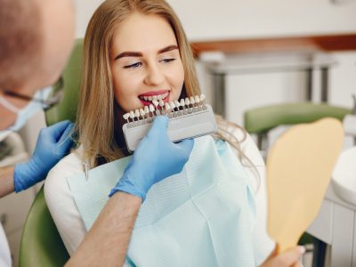 girl sitting in dental clinic for implant procedure