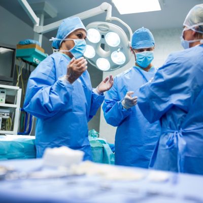 Surgeons at operating room to performing orthopedic surgery