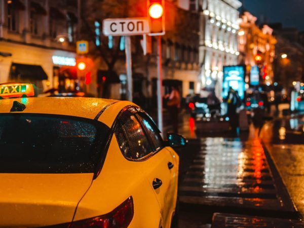 yellow taxi at night in uk